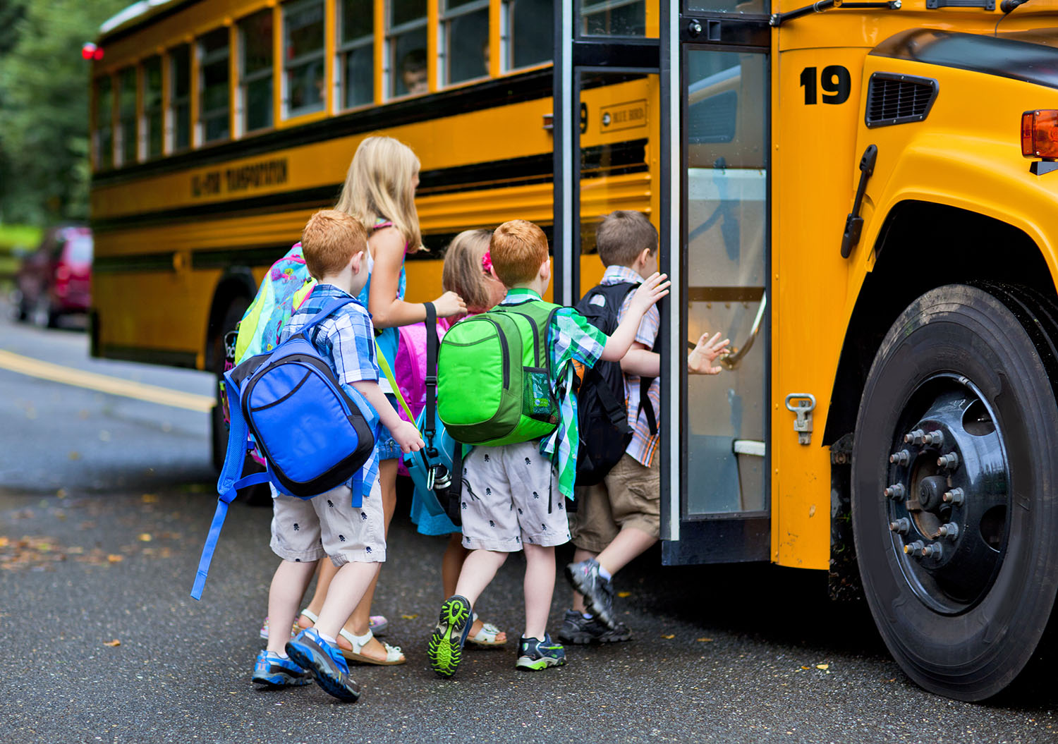 Children getting on the school bus